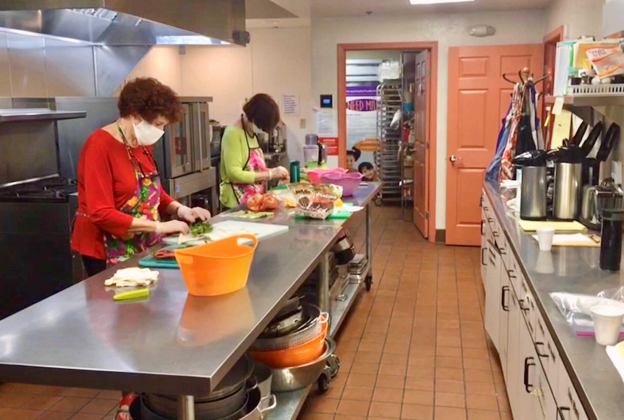 Fireman sisters cooking in the shelter kitchen