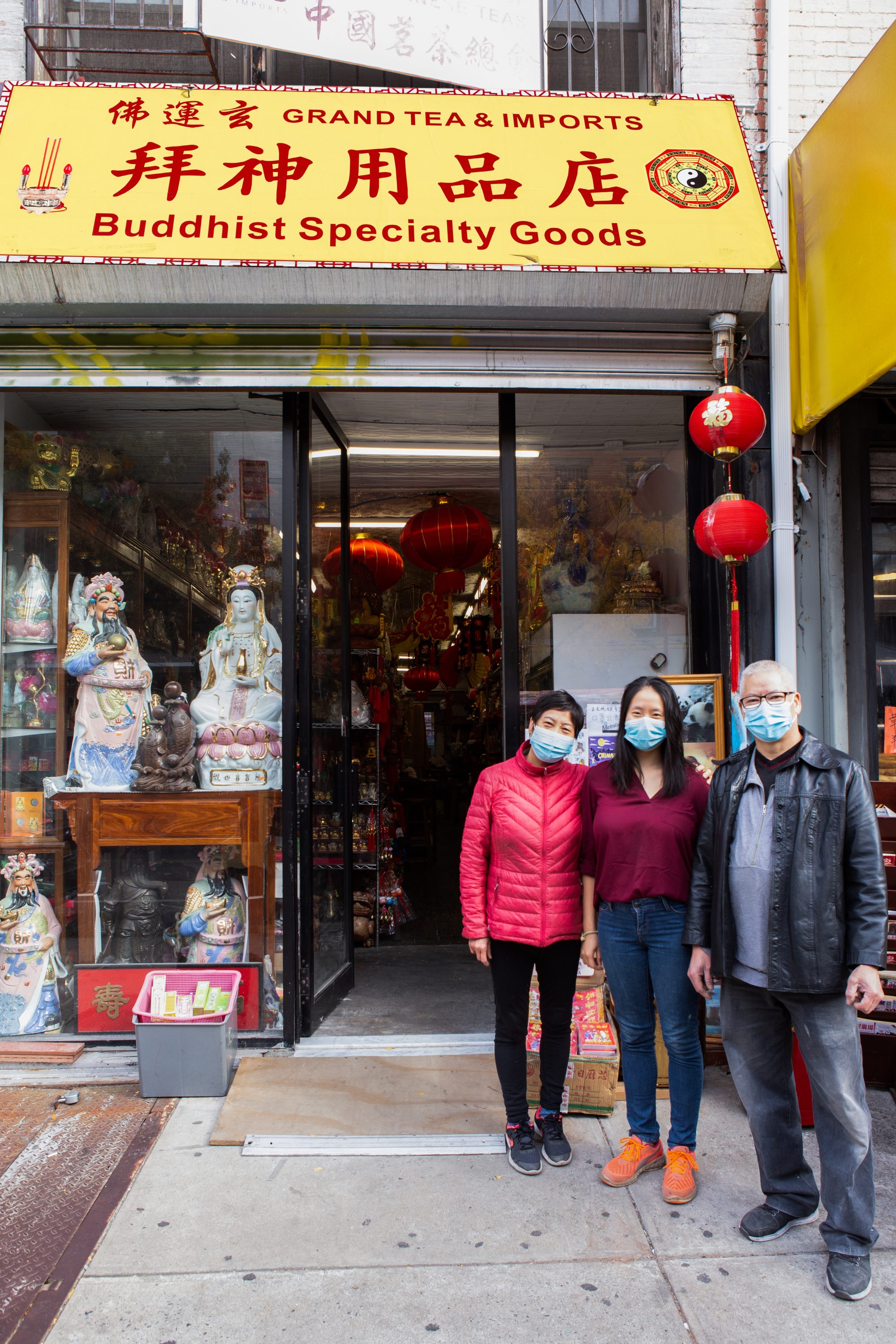 Liu sisters standing in front of a tea store in New York City
