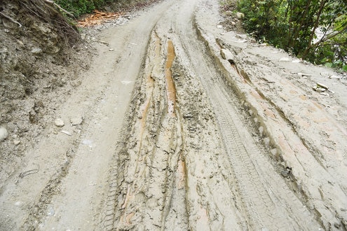 A muddy road after a flood