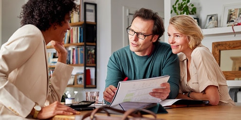 Couple having a conversation with a financial advisor