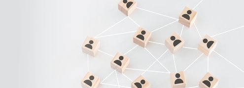 Wooden blocks showing networking connections.