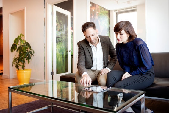 couple reading tablet together