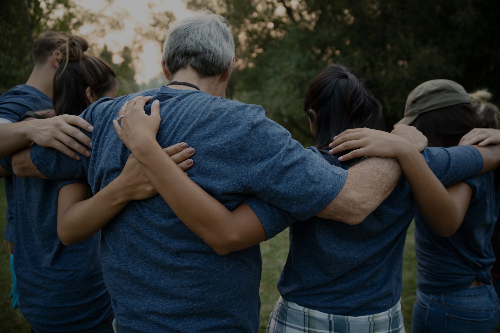 People hugging in a circle