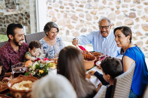 Happy family around table