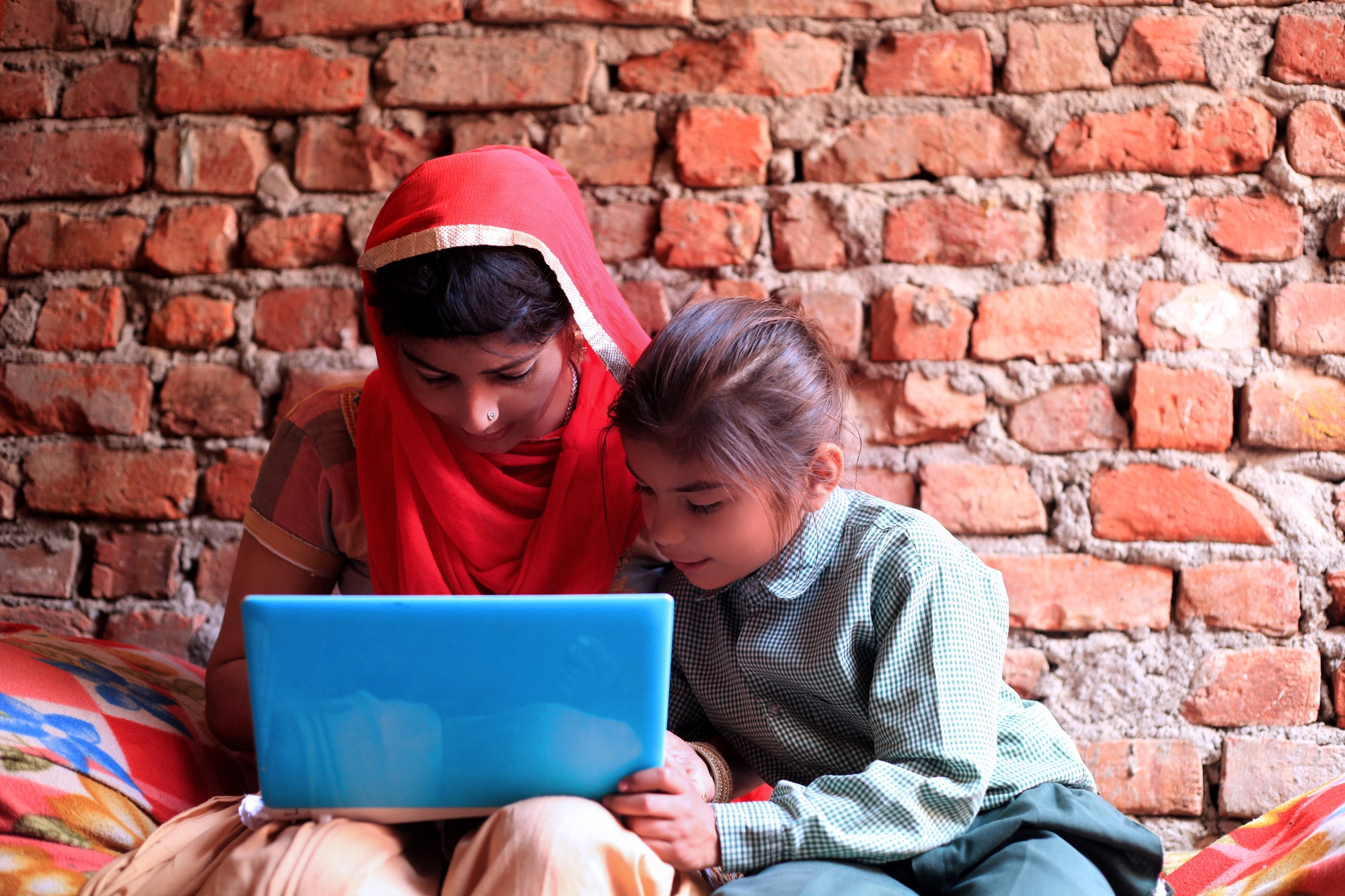 Children using tablet to represent entrepreneur Rob Friedman’s innovative philanthropic solutions in education.
