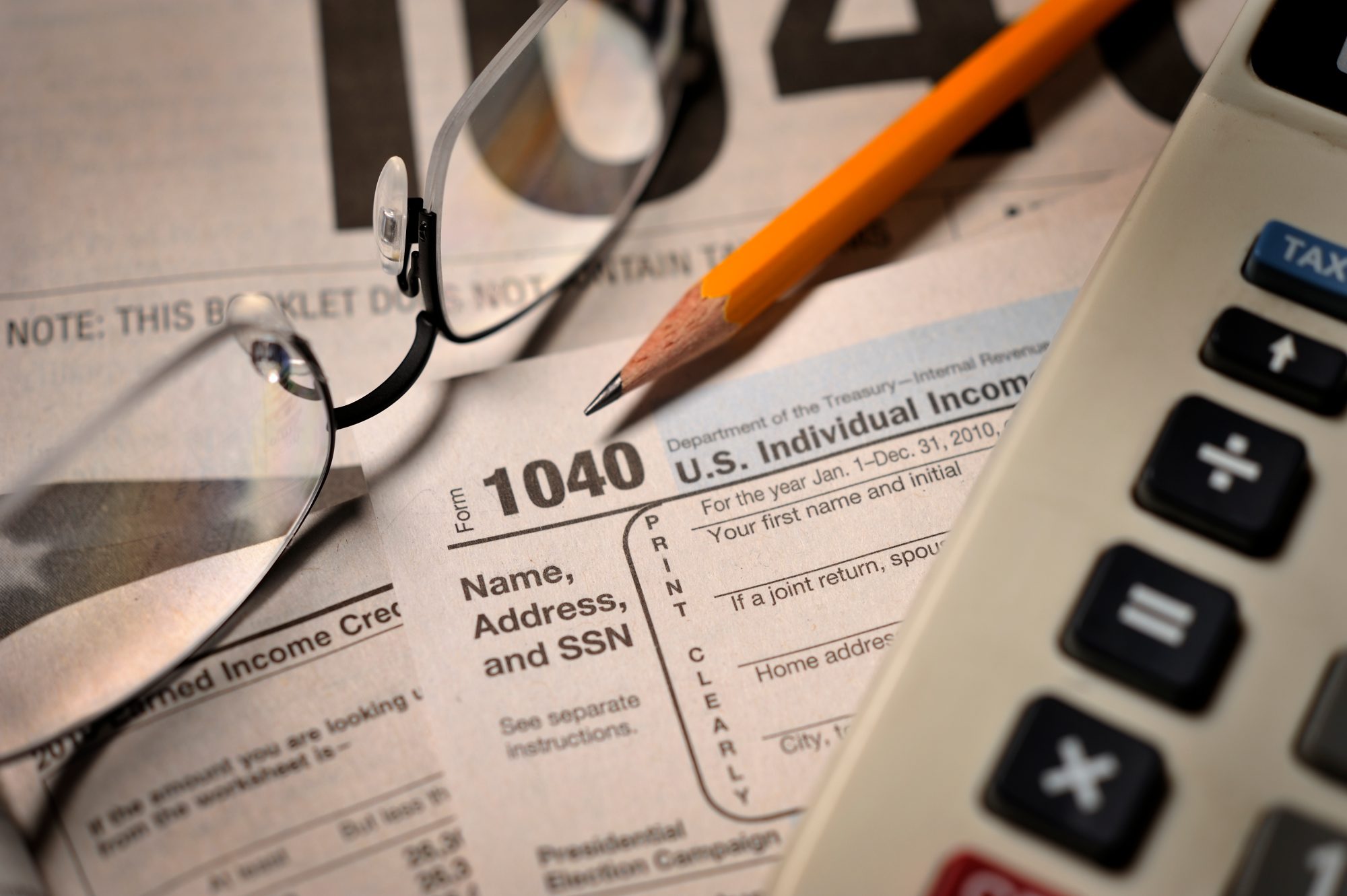 Tax papers, glasses and calculator 