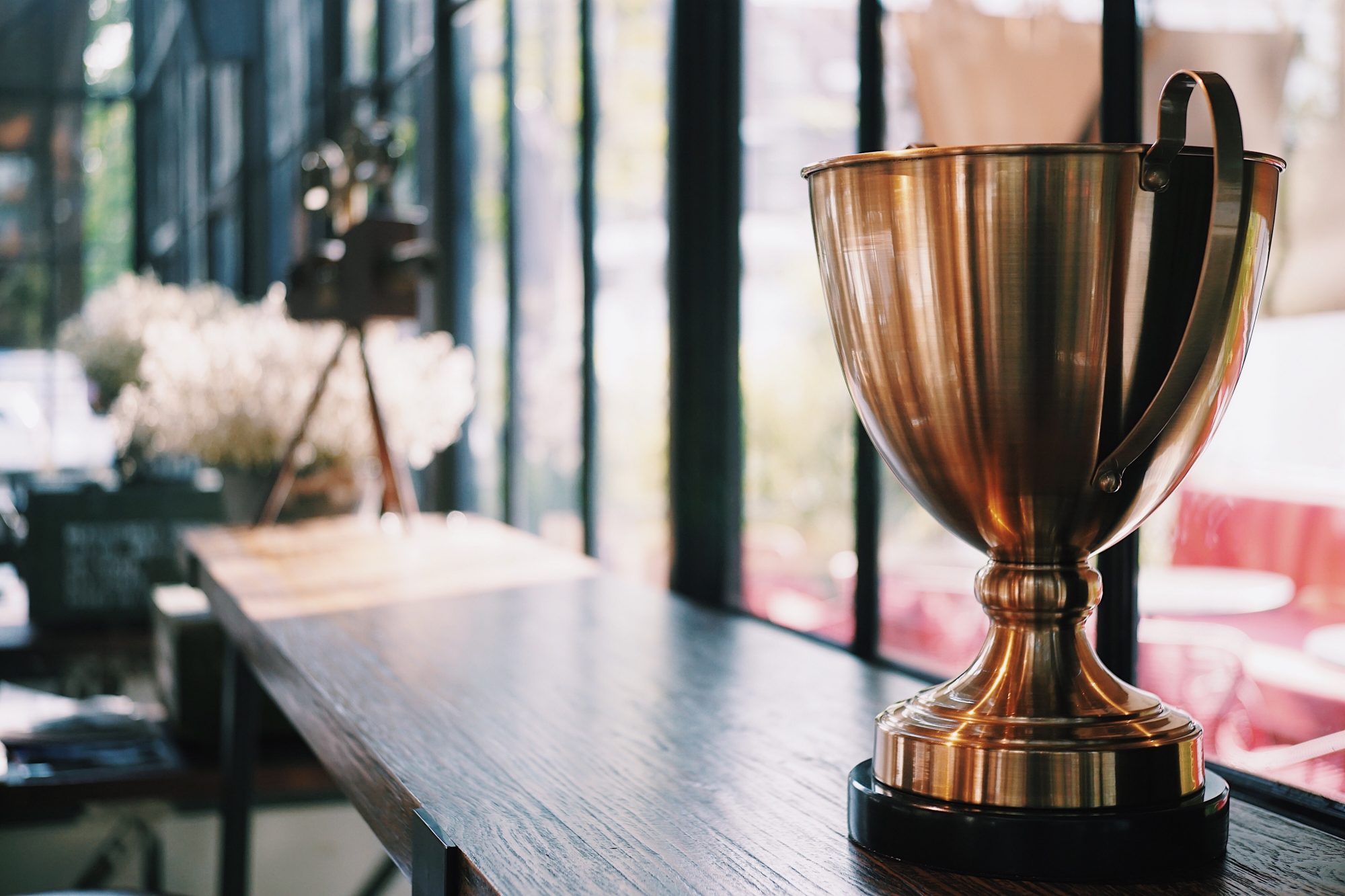 Gold trophy sitting on a shelf 