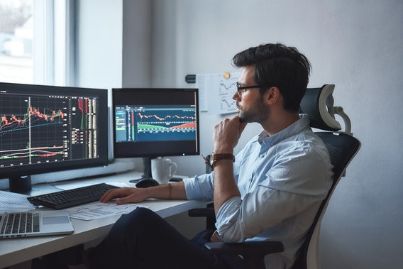 couple talking to financial advisor about donating stock 