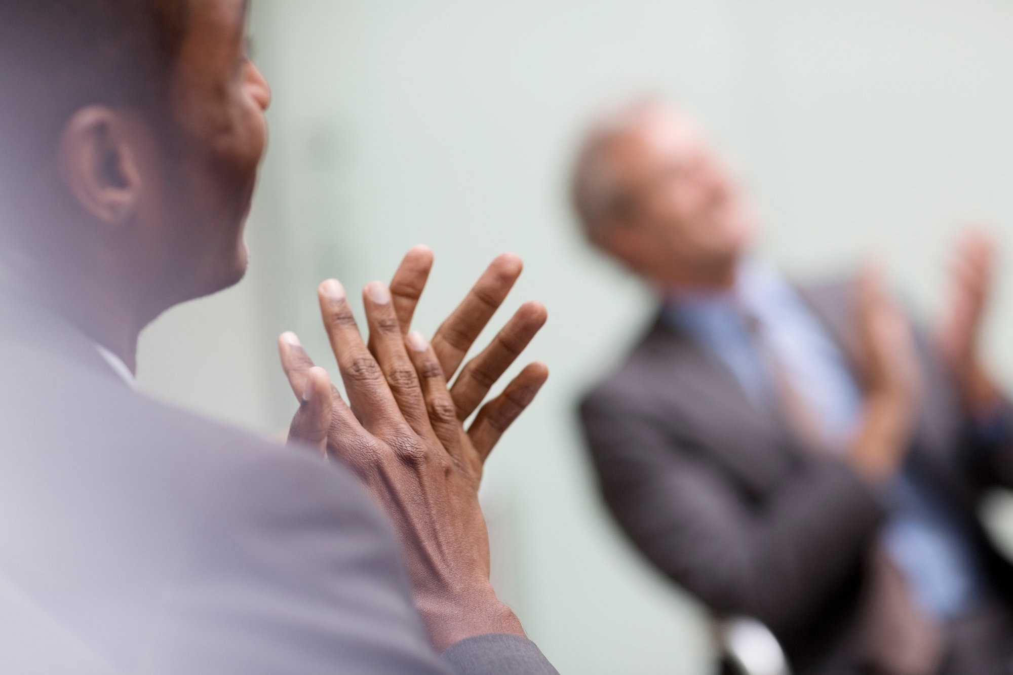 Two men clapping hands