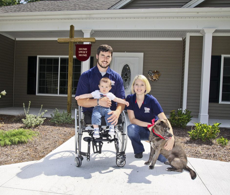 Family in front of new home