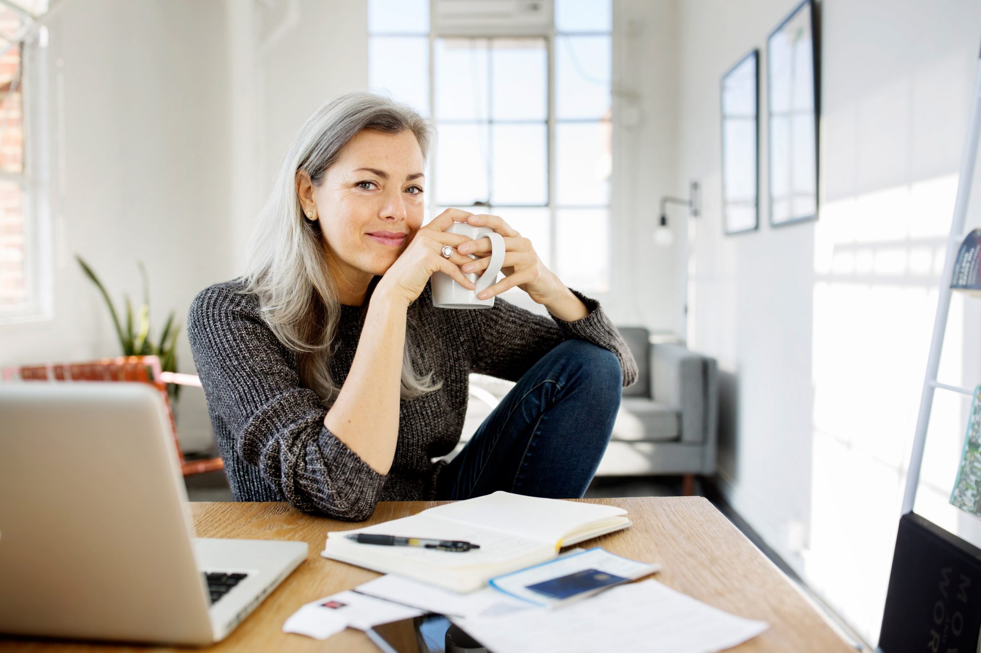 Photo of older adult woman at desk