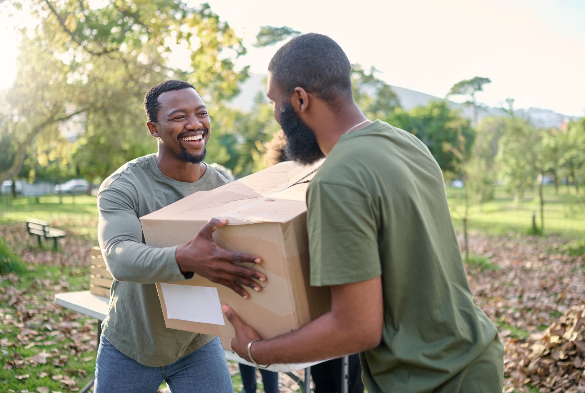 Workers volunteering passing along a box
