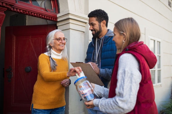 Fundraisers talking to women