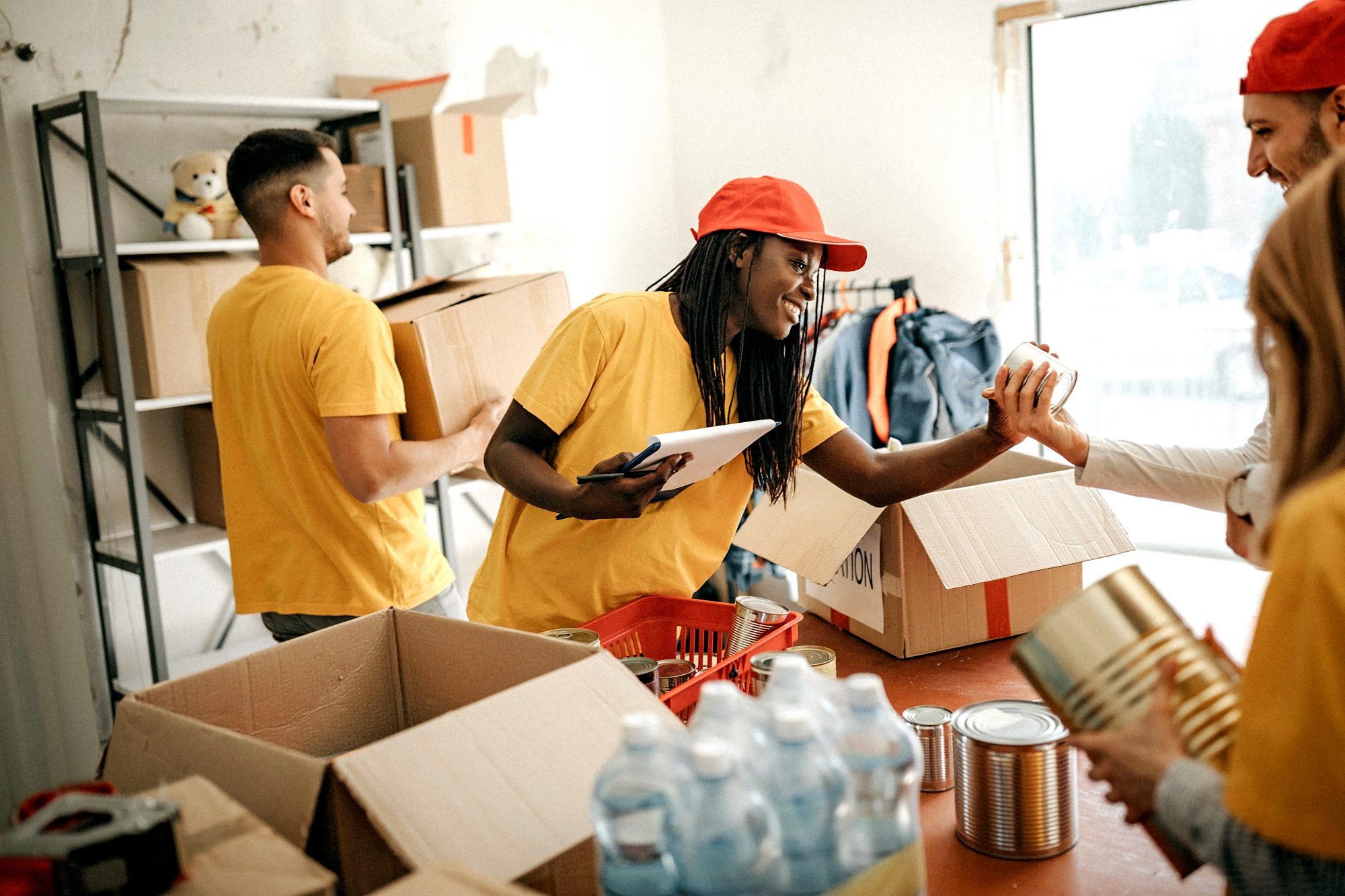 People sorting canned food donations