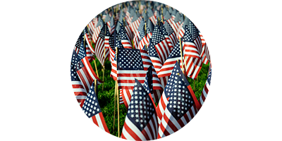American flags in a field to represent supporting American veterans and first responders