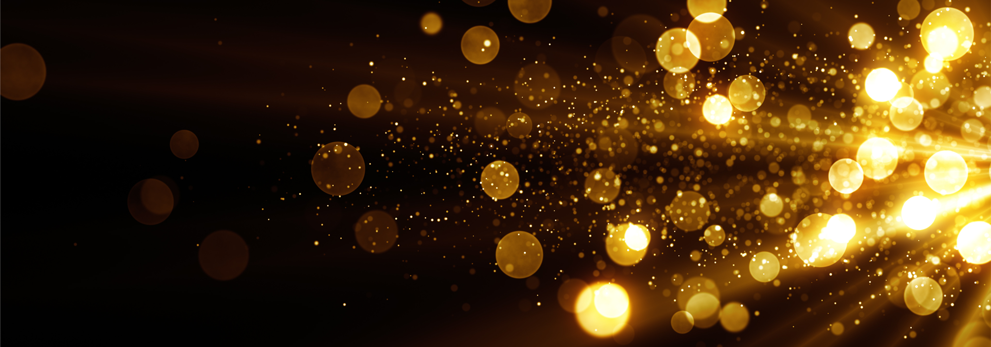 Golden sparkles on a dark background